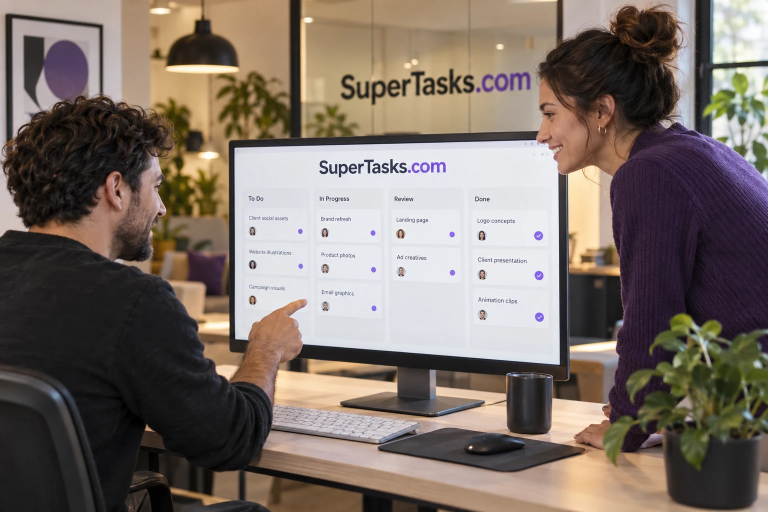 A small team reviewing task software together with SuperTasks.com signage